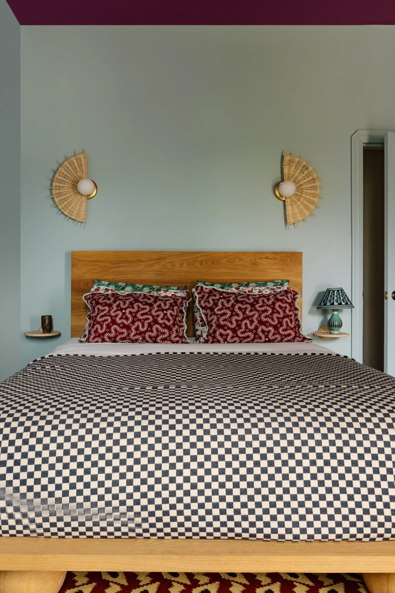 guest room with a vintage sconces from a flea market and a lamp with a painted elm finish