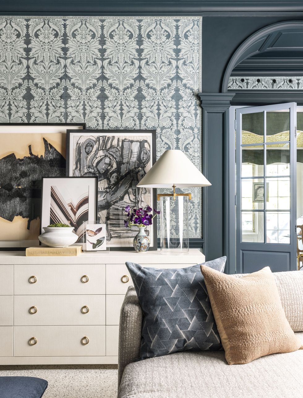 This elegant entryway features a blend of traditional and modern elements.