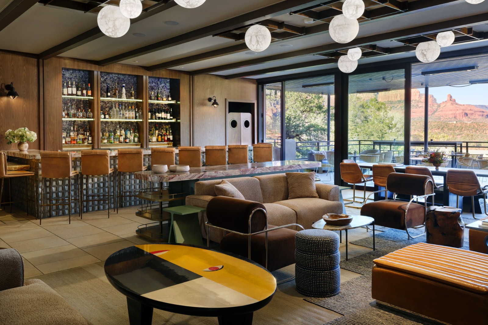 This image showcases a luxurious bar and lounge area, featuring a sophisticated design project with stylish furniture and decor that perfectly blends comfort and elegance.