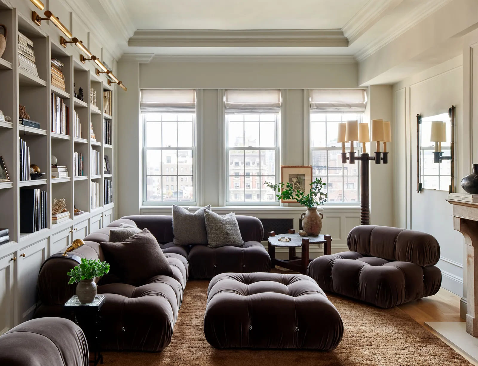 living room in earth tones with a modern borwn sofa