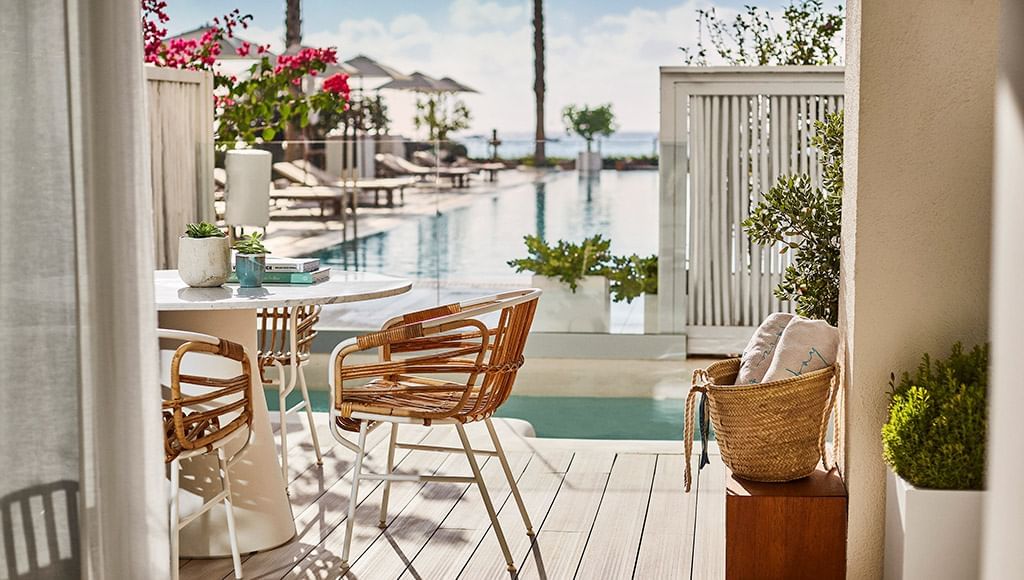 5 Exceptional Hospitality Design Experiences: Luxury Travel. Private room terrace with a swimming pool and outdoor furnitures