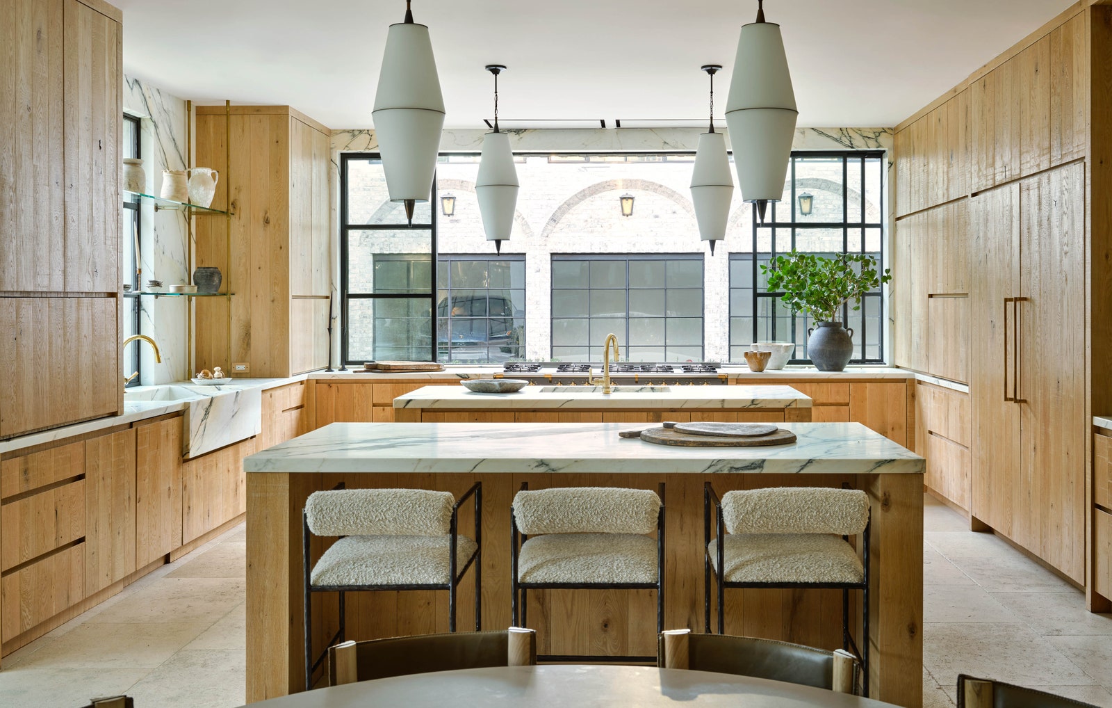 LA Home kitchen with arteriors benches upholstered in linen