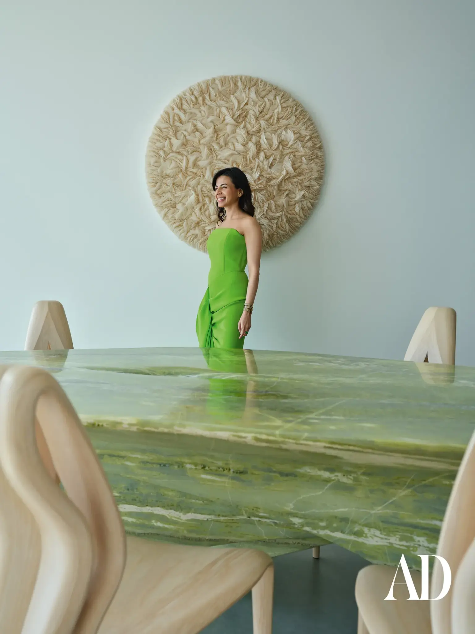 The Art of Minimalist Luxury: Inside a Dubai Penthouse Inspired by Nature , dining table made from natural stone and sculptured chairs