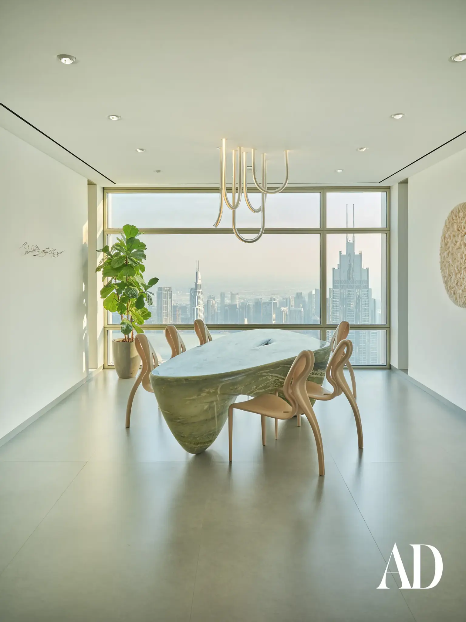 The Art of Minimalist Luxury: Inside a Dubai Penthouse Inspired by Nature , dining room and table, large window, natural light