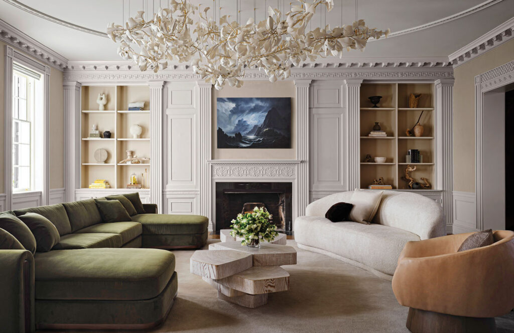 Discover Timeless Craftsmanship: Luxury Interior Design at Georgetown , A moss-green velvet sofa anchors the space, paired with a cream curved sofa for soft contrast. Between them, stacked pale-wood coffee tables create sculptural interest.