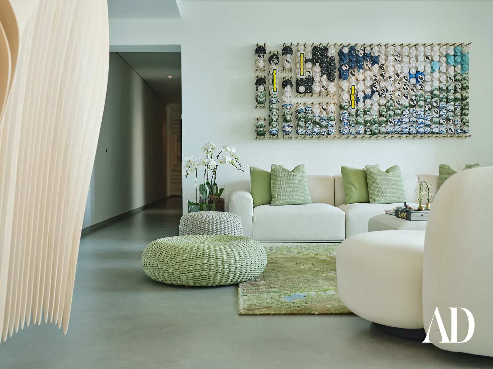 The Art of Minimalist Luxury: Inside a Dubai Penthouse Inspired by Nature , living room with art work, rug, sofa and designed unique furniture