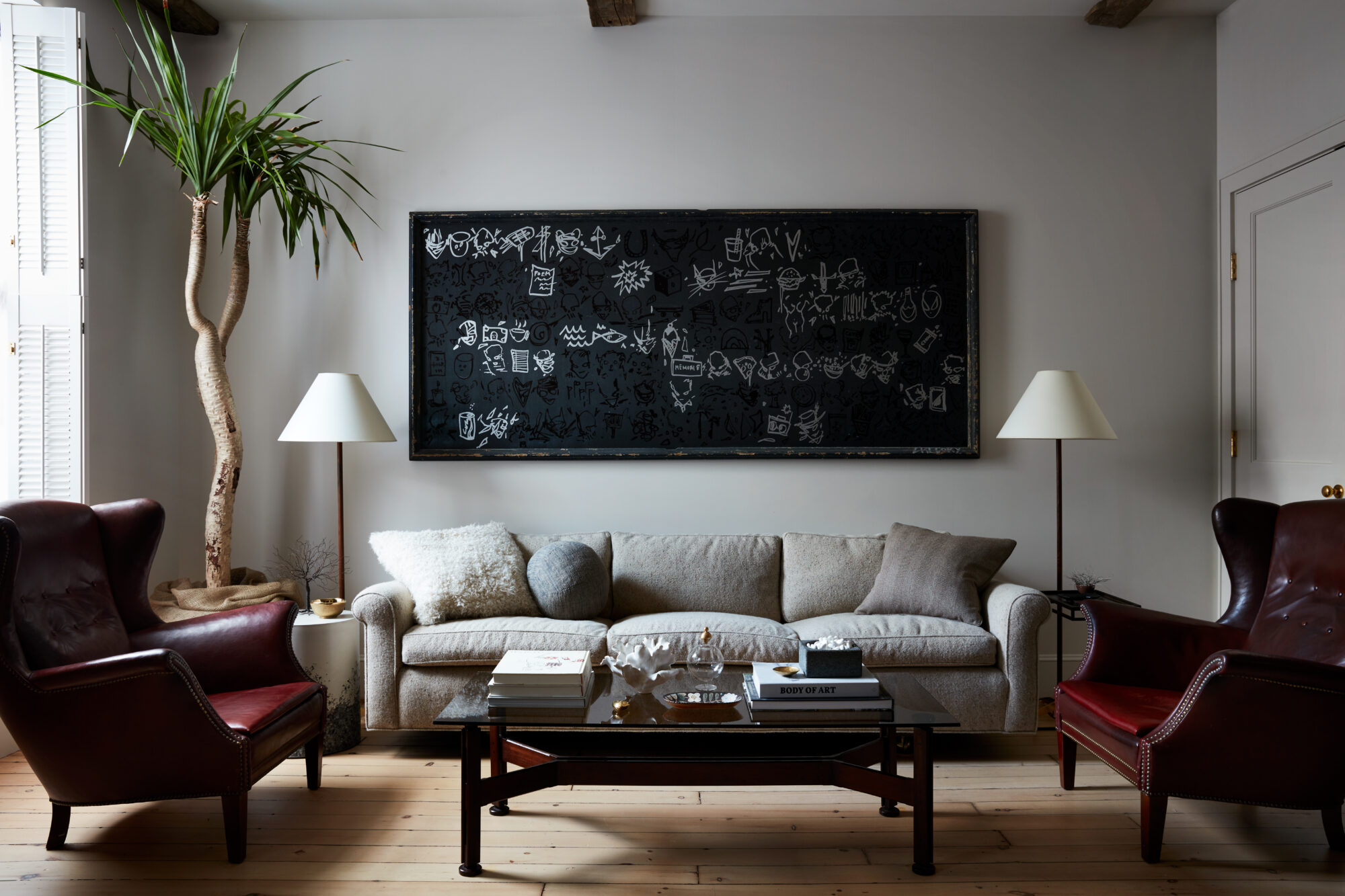 living room with grey walls and a indoor tree