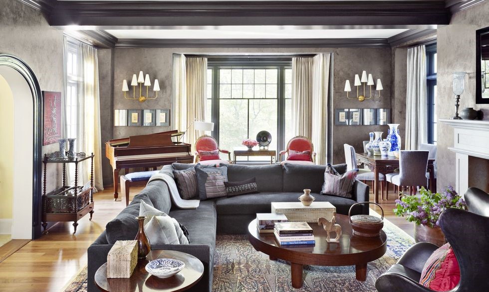 living room idea by Mona Hajj with a piano