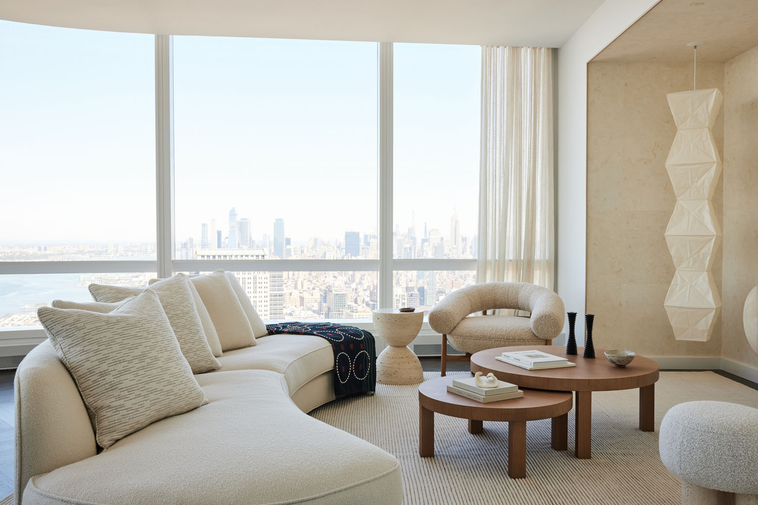 A modern living room by Jessica Gerstein featuring all matching beige furniture