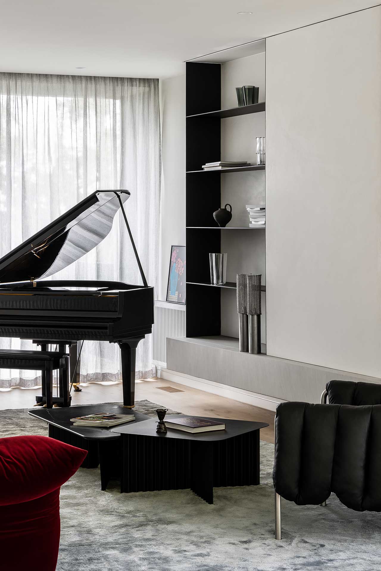 A modern living room featuring a grand piano