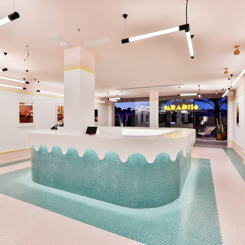 Reception desk in the memphis style decorated with green tiles