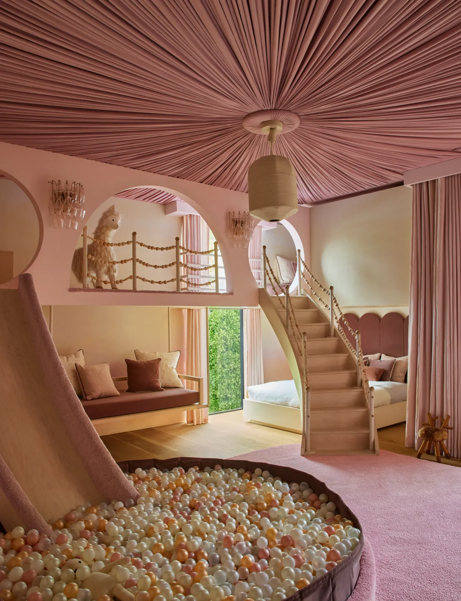 Luna’s fantasy bedroom has a custom bed and slide, and a ceiling tented
