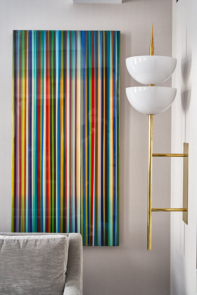 Wall lamp and colourful contemporary art piece in a decorating project by Micheller Gerson creating a modern and fun interior