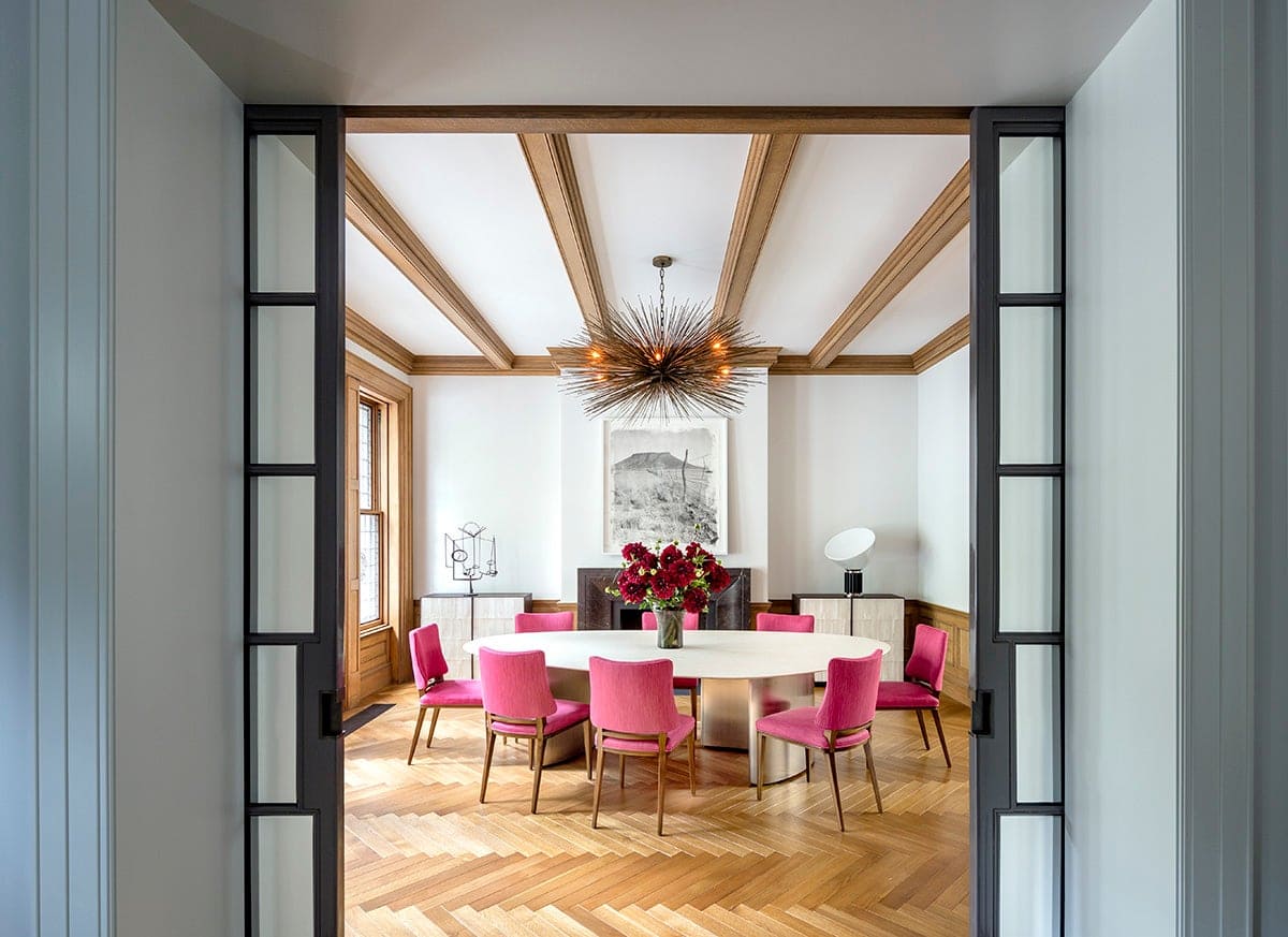 dining room with pink chair and white table