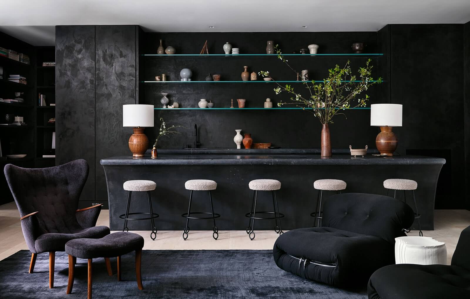 Nate Berkus & Jeremiah Brent Style a Hommés Studio Round Travertine Coffee Table on Brian Robbins and Tracy James New Home In Beverly Hills