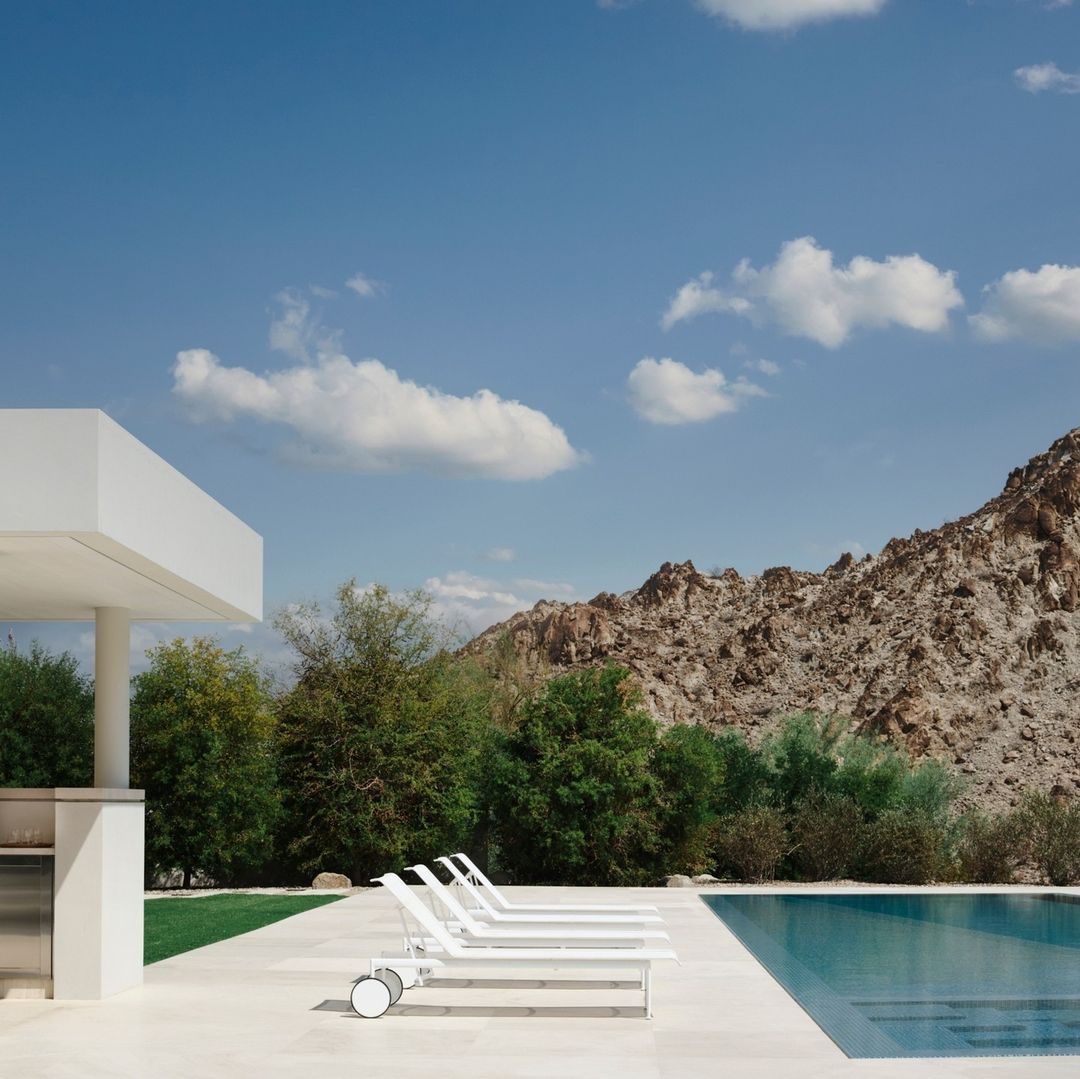 exterior of the desert house with a outdoor kitchen and pool