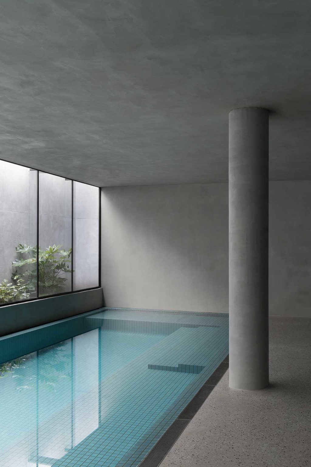 An indoor pool in a modern basement