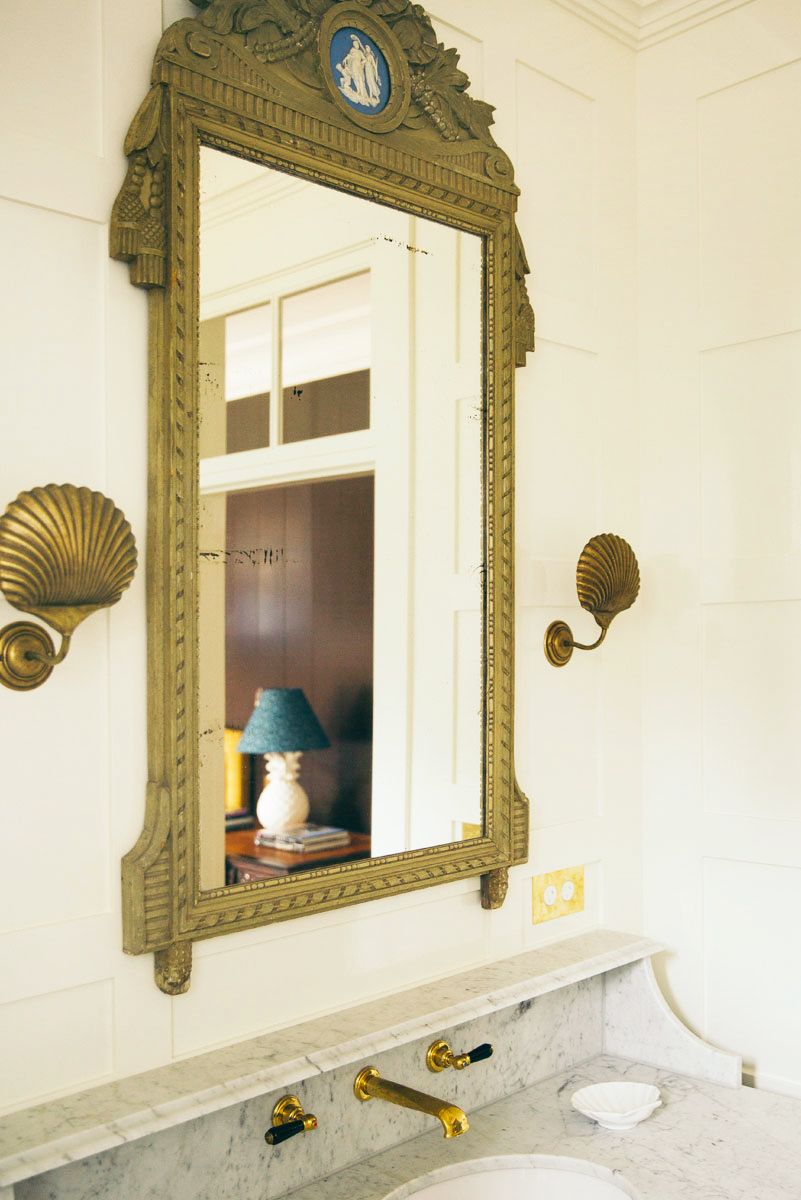 bathroom with shells in the mirror