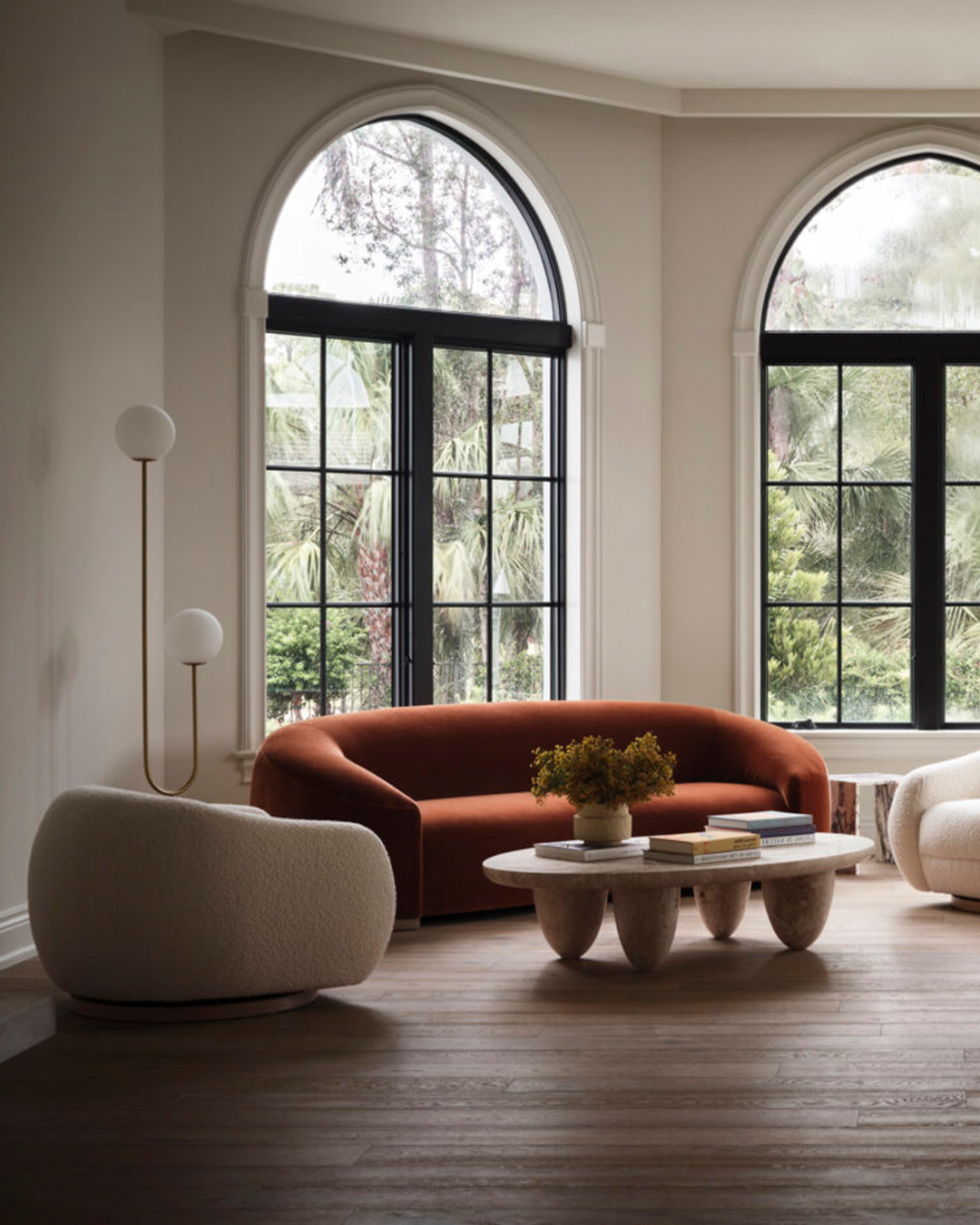 This image depicts a beautifully designed living room project, featuring modern, elegant furniture and decor that create a serene and inviting atmosphere.