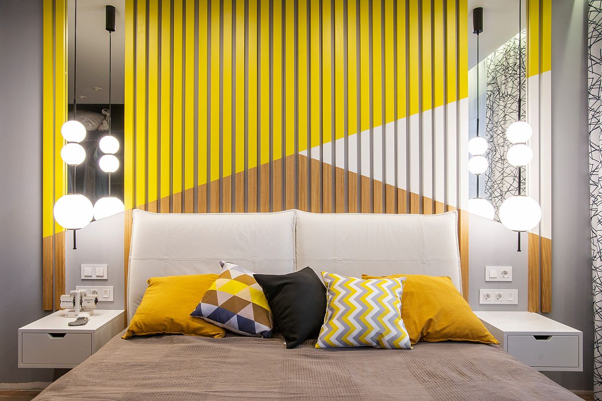 A bedroom with yellow and white accents, creating a bright and cheerful atmosphere.